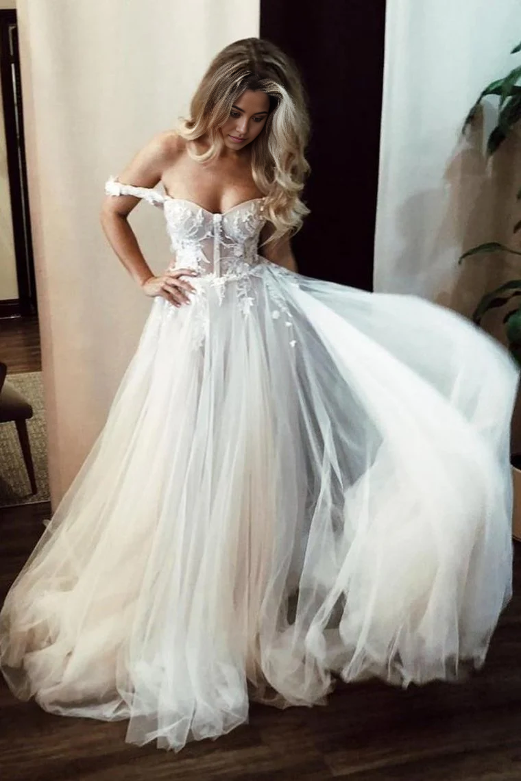 Vestido de novia largo color marfil con escote en forma de A y hombros descubiertos, escote corazón y apliques
